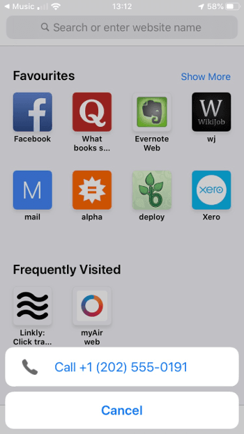 iPhone screen showing a prompt to call the phone number after scanning the QR code
